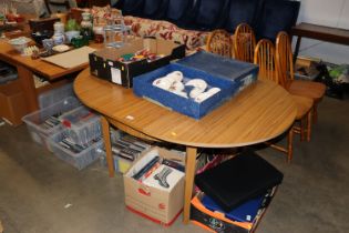 A Formica drop leaf dining table