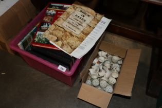 A box of crested miniature souvenir shaving mugs a