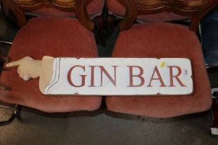 A bag of various textiles, a Gin Bar sign, brass c