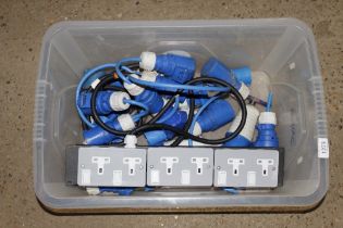 A box containing electrical sockets, three pin plu