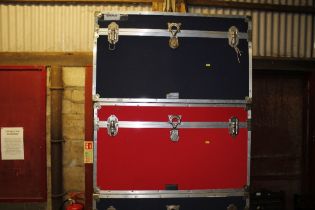 A red flight case and blue flight case