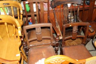 A 1930s oak elbow chair and a pair of similar sing