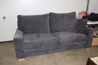 A John Lewis two seater settee upholstered in charcoal grey weave, complete with cushions
