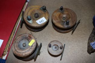 Four vintage wooden fishing reels