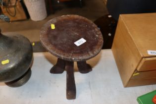 A rustic wooden stool