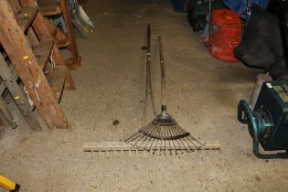 Two long handled rakes