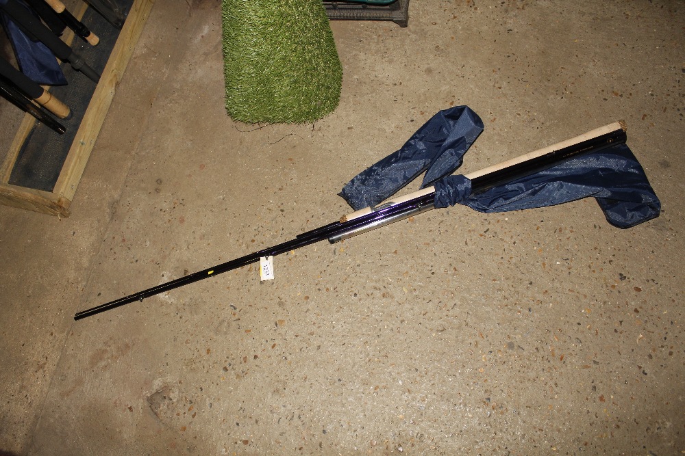 An Abu Conolon feeder fishing rod with bag