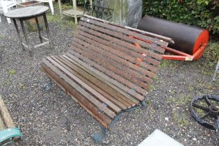 A metal and wooden garden bench