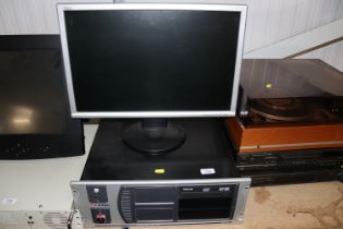 A rack mounted desk top computer and monitor