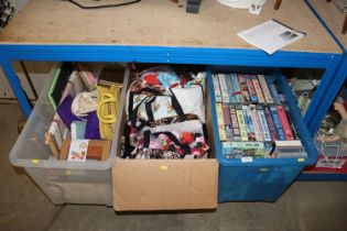 A collection of videos, two boxes of fabrics etc.