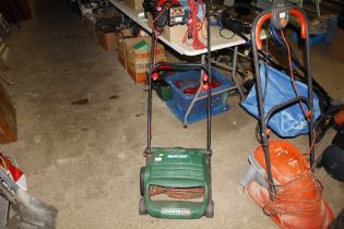 A Qualcast concord electric mower, lacking grass box