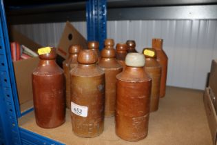 A collection of vintage stoneware bottles