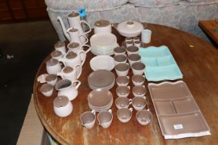 A collection of Poole pottery twin tone tea and di