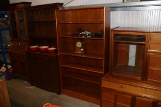 A teak open fronted bookcase