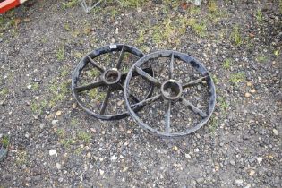 Two cast iron wheels