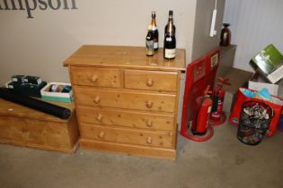 A pine chest of two short and three long drawers