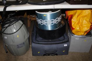 A suitcase and three lampshades