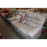 A floral upholstered three seater sofa