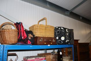 A wicker hamper; a vintage suitcase and two modern