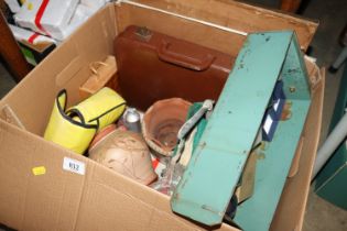 A box of miscellaneous items including small leath