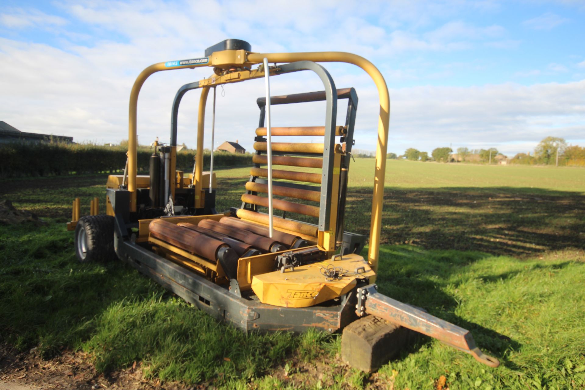 Tanco Autowrap 1418S static automatic bale wrapper. Bale count 39,497. 3,257 hours. With self-