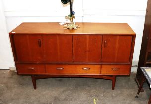 A G-plan design teak sideboard, enclosed by foldin