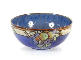 A Doulton glazed pottery fruit bowl, decorated on