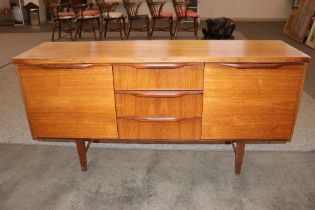 A teak G-plan design sideboard fitted three centra