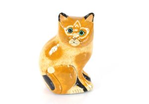 A papier mâché ginger cat in the style of Joan De