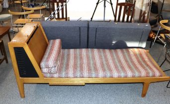 A vintage golden oak day bed settee