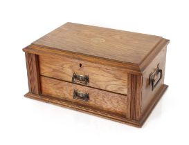 An oak cased two drawer canteen of plated cutlery