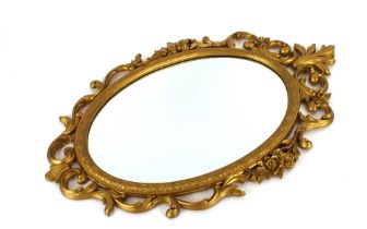 A "Hollywood Regency" wall mirror by Syroco USA, 9