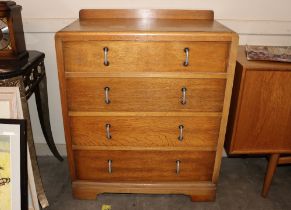 An Art Deco light oak chest fitted four long drawer