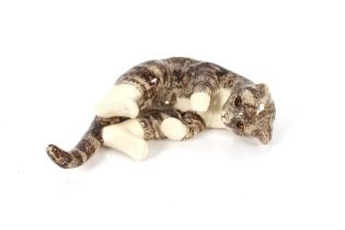 A Winstanley pottery model of a recumbent cat, 43c