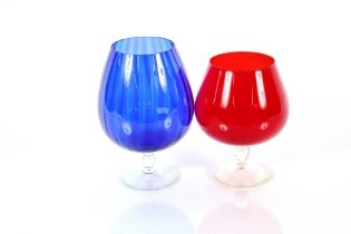 A large sized blue glass brandy goblet; and a red