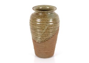 A glazed stoneware baluster vase, of ribbed design