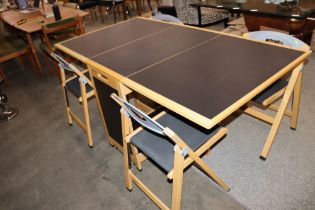 An Italian Foppapadretti folding table in solid be