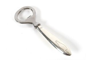 A silver handled Cartier bottle opener of simple d