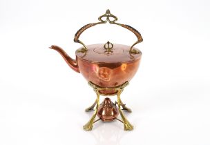 An Arts & Crafts design copper and brass tea kettl