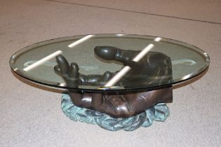 A modern design bronze and plate glass coffee tabl