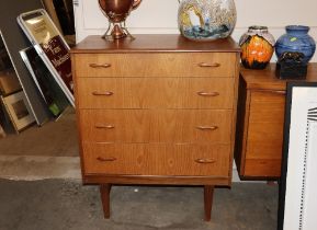 A teak G-plan design chest of four long graduated