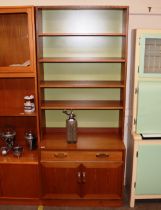 A teak G-plan dresser, with open shelves above sin