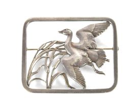 A Georg Jensen silver brooch, depicting bird in fl