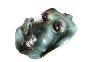 A green glazed nude female torso, 70cm lon