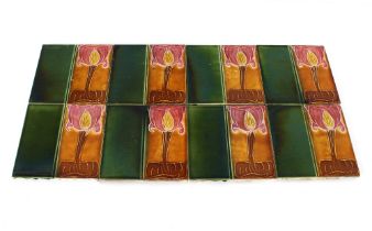 A set of eight Art Nouveau pottery tiles