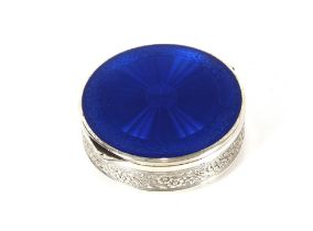 A Sterling silver circular pot with blue enamel de