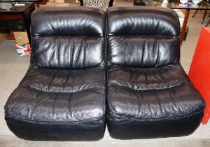 A pair of modern design black leather upholstered