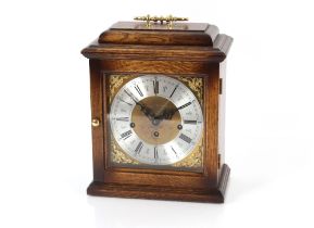 A 20th Century oak cased chiming mantel clock by F