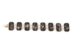 A Japanese Damascene yellow metal panel bracelet;