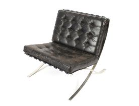 A chrome and leather Barcelona style chair